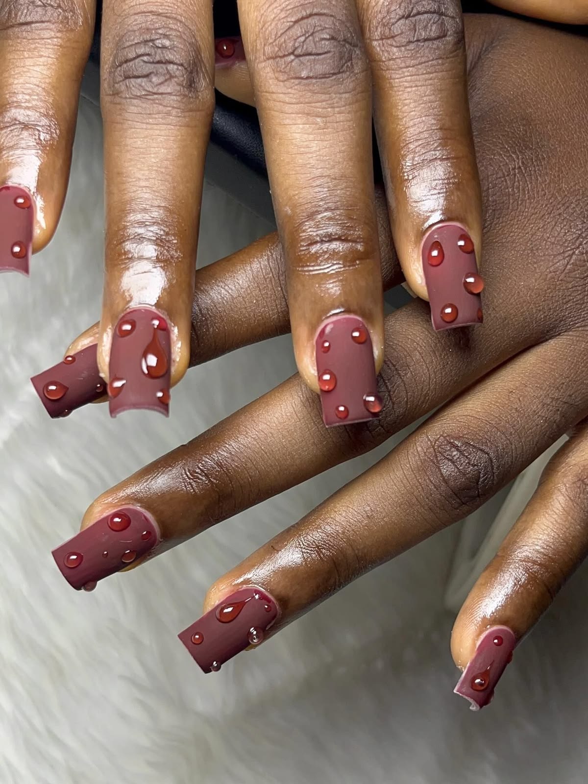 Burgundy nails with 3D droplet art