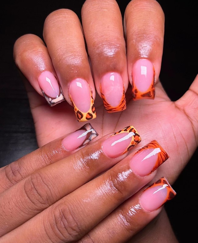 Pink nails with animal print French tips